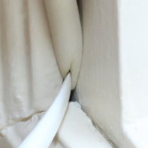 Gapseal half installed into a window gap